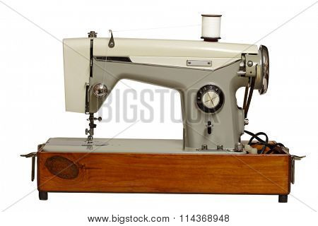 Old sewing machine isolated on white background