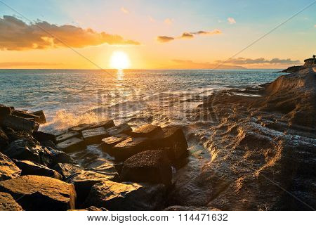 Rocks at topical beach at beautiful sunset.Costa Adeje, Tenerife, Spain