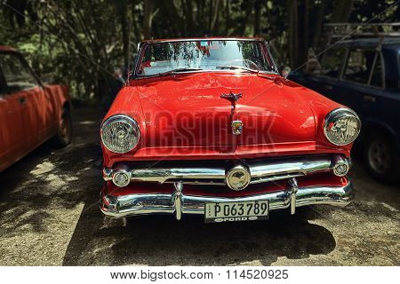 CUBA, HAVANA-JUNE 26, 2015: Classic red Ford on a street in Havana.