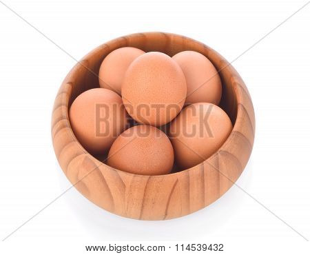 Egg In A Wooden Bowl Isolated On White Background