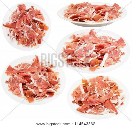 Set Of Plates With Slaced Dry-cured Ham Isolated