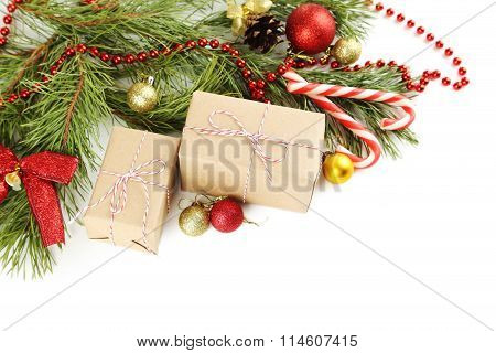 Christmax Tree Branch With Baubles, Gift Boxes And Candies On White Background