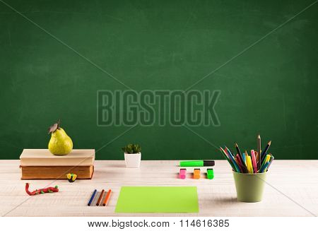 Back to school concepty with clear blackboard background, desk, items