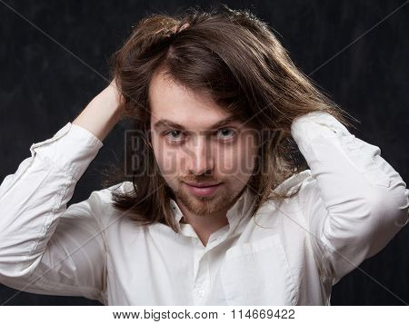 Man With Long Hair Stiring It Up