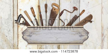 Signboard And Carpenter Tools On Wooden Background