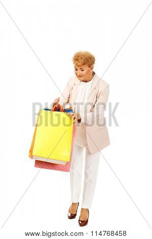 Happy business woman holging shopping bags