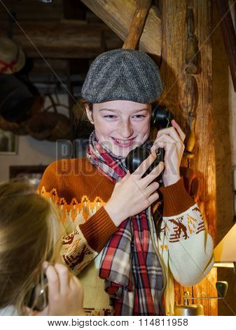 Two Sisters Playing With Old Vintage Telephon
