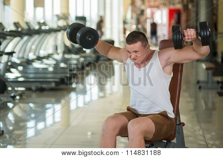 Guy working out in gym.