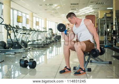 Guy working out in gym.