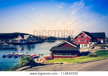 Sea Cliffs And Houses On The Sea In Norway