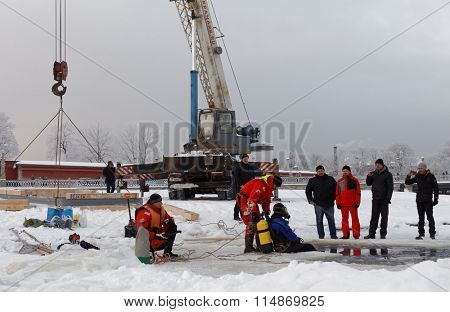 ST. PETERSBURG, RUSSIA - JANUARY 17, 2016: Emercom staff build the ice hole for celebrations of the Baptism of Jesus. In Eastern Christianity, the Baptism of Christ is commemorated on January 19