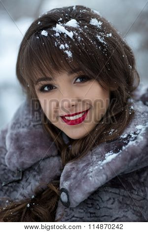 Beautiful portrait of cute, cutie, nice, adorable, delightful, beautiful, cheerful, smiling, happy, excited, natural girl with very, cute, white, healthy smile,dentist,cosmetics,makeup,ice,snow,snowflakes in hair.