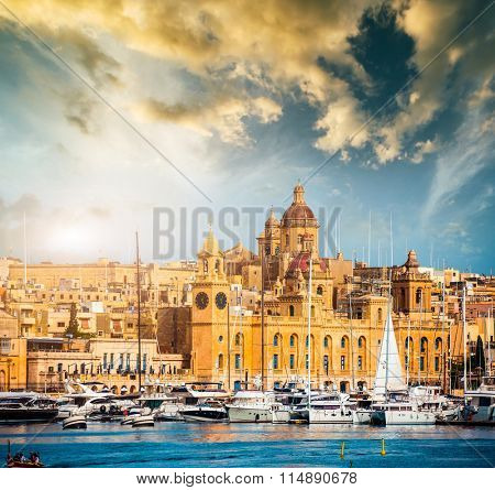 beautiful view on Birgu and the harbour with colorful boats in Malta