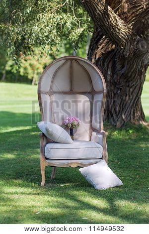Wedding bouquet of peonies, on a beautiful chair 2