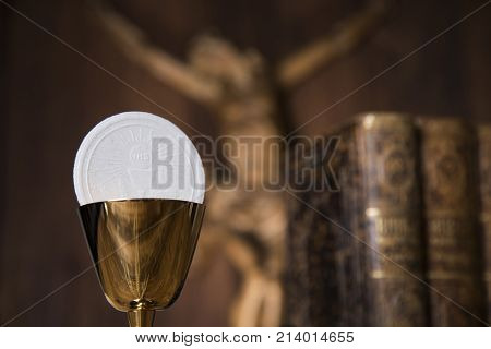 Eucharist symbol of bread and wine, chalice and host, First communion background