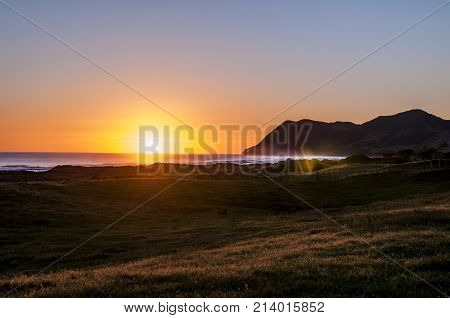 First sunrise seen on earth, on the coast of East Cape New Zealand.