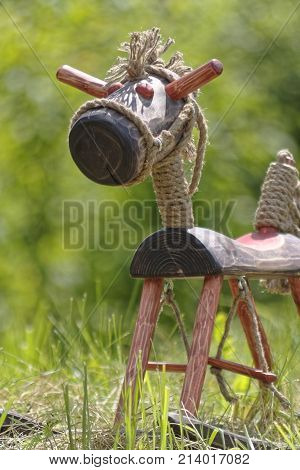hand made wooden horse on green grass