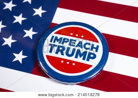 LONDON UK - NOVEMBER 15TH 2017: Anti-Tump badge over an American flag background on 15th November 2017.