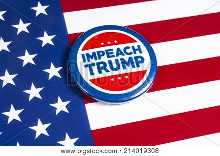 LONDON UK - NOVEMBER 15TH 2017: Anti-Tump badge over an American flag background on 15th November 2017.