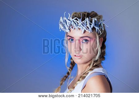Fantasy winter queen from fairytale forest, ice makeup
