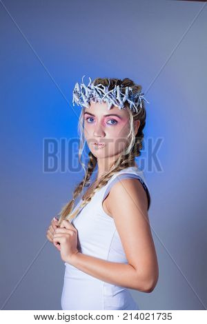 Fantasy winter queen from fairytale forest, ice makeup