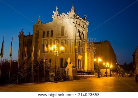 Night Kiev cityscape. House with Chimeras or Horodecki House illuminated by night lights