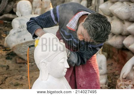 Mandalay, Myanmar - December 29: Unidentified Man Works On A Statue Near Mahamuni Pagoda On December