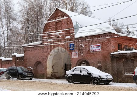 NIZHNY NOVGOROD, RUSSIA - NOVEMBER 07, 2016: Main entrance of the Red (Bugrovsky) cemetery at winter. The cemetery was planned at the turn of the 1880s-90s.