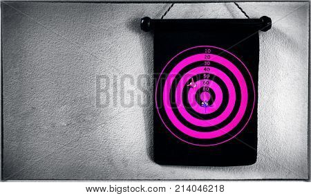 Circular Pink Target with Magnetic Darts on the Wall