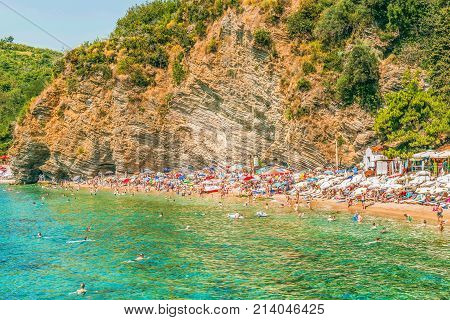 Budva, Montenegro - August 18, 2017: Fragment of Mogren beach in Budva, Montenegro is one of the most popular beaches on the Budva Riviera.