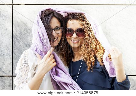 Couple Of Pretty Young Woman In The Center Of A Capital City