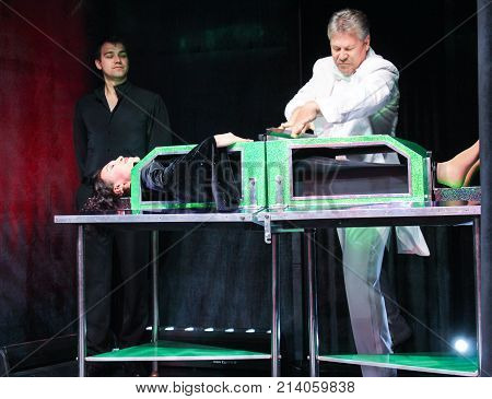 St. Petersburg, Russia - 3 October, The illusionist inserts the partitions, 3 October, 2017.
Speech show illusionists at the St. Petersburg gas forum.