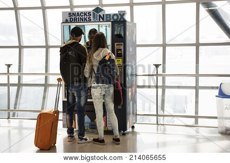 Foreigner Travlers Lovers Buying Food And Drink From Automatic Vending Machine At Suvarnabhumi Inter