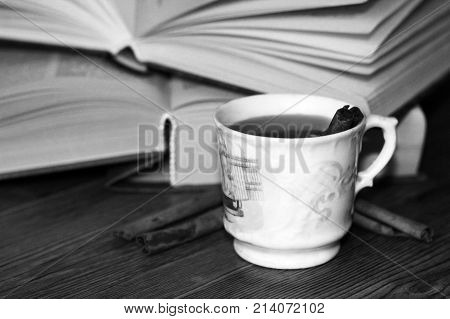 A Cup Of Coffee, Cinnamon Sticks And Old Books