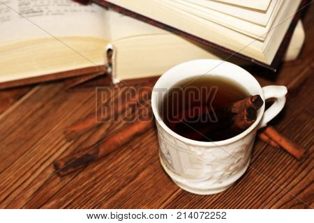 A Cup Of Coffee, Cinnamon Sticks And Old Books