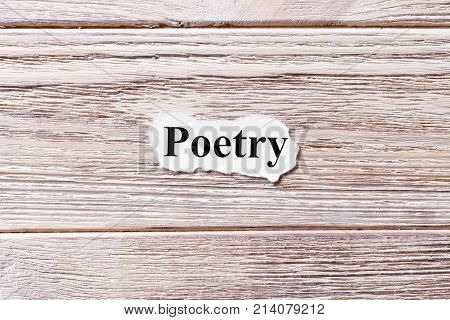 poetry of the word on paper. concept. Words of poetry on a wooden background.