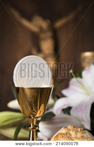 Eucharist symbol of bread and wine, chalice and host, First communion background