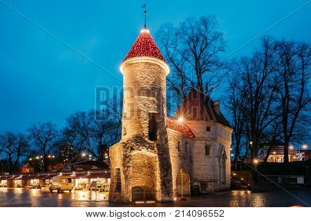 Tallinn, Estonia. Famous Landmark Viru Gate In Street Lighting At Evening Or Night Illumination. Christmas, Xmas, New Year Holiday Vacation In Old Town. Popular Touristic Place.