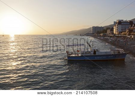 Lazarevskoe, Sochi, Krasnodar region, Russia - June 30, 2014: Sunset on the beach in Lazarevsky, Sochi
