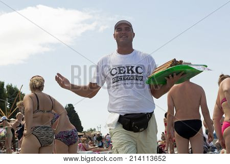 Lazarevskoe, Sochi, Krasnodar region, Russia - June 30, 2014: Seller sweet tubules on the beach in Lazarevskoe, Sochi