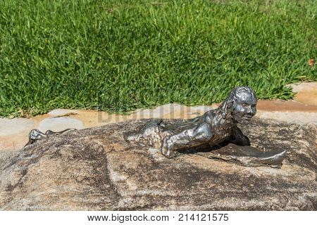 Sydney Australia - March 26 2017: Closeup of small image artwork of Surfing The Bower Break on a rock near Shelly Beach in Manly.