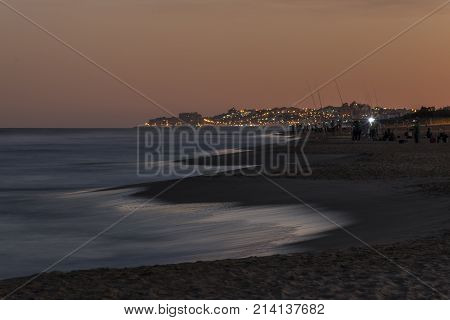 View Of Fishermen In Guardamar Del Segura At Nightfall