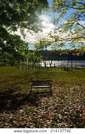 Beautiful landscape with a wooden bench looking off into the waters