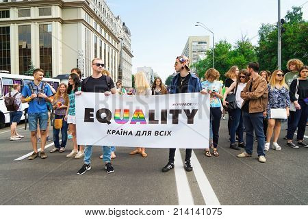 KYIV, UKRAINE - JUNE 18, 2017: Activists holding agitative poster on gay pride