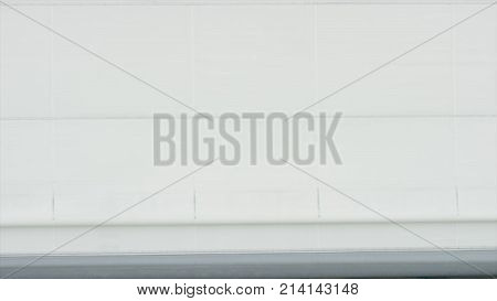 Roller Shutter Door And Plane In Hangar Background. Business Jet Airplane Is In Hangar. Private Corp