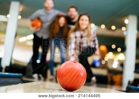 Friends having fun while bowling and speding time together