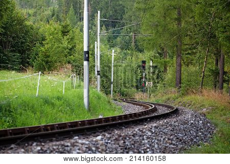 Scenic railway in the summer forest near Vysne Hagy in High Tatra Mountains, Slovakia, Europe