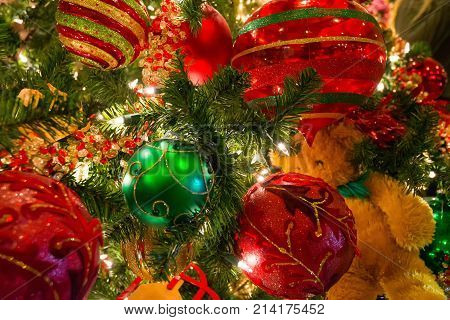 Close Up Of Christmas Ornaments Of Variety Of Balls And Teddy Bear. Christmas Texture