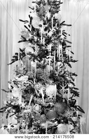 Beautiful Christmas Tree Decorates With Silver Glittery Ornaments