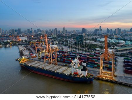 Containers yard in port congestion with ship vessels are loading and discharging operations of the transhipments in international port.